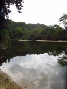 A river so still it shows beautiful reflections.